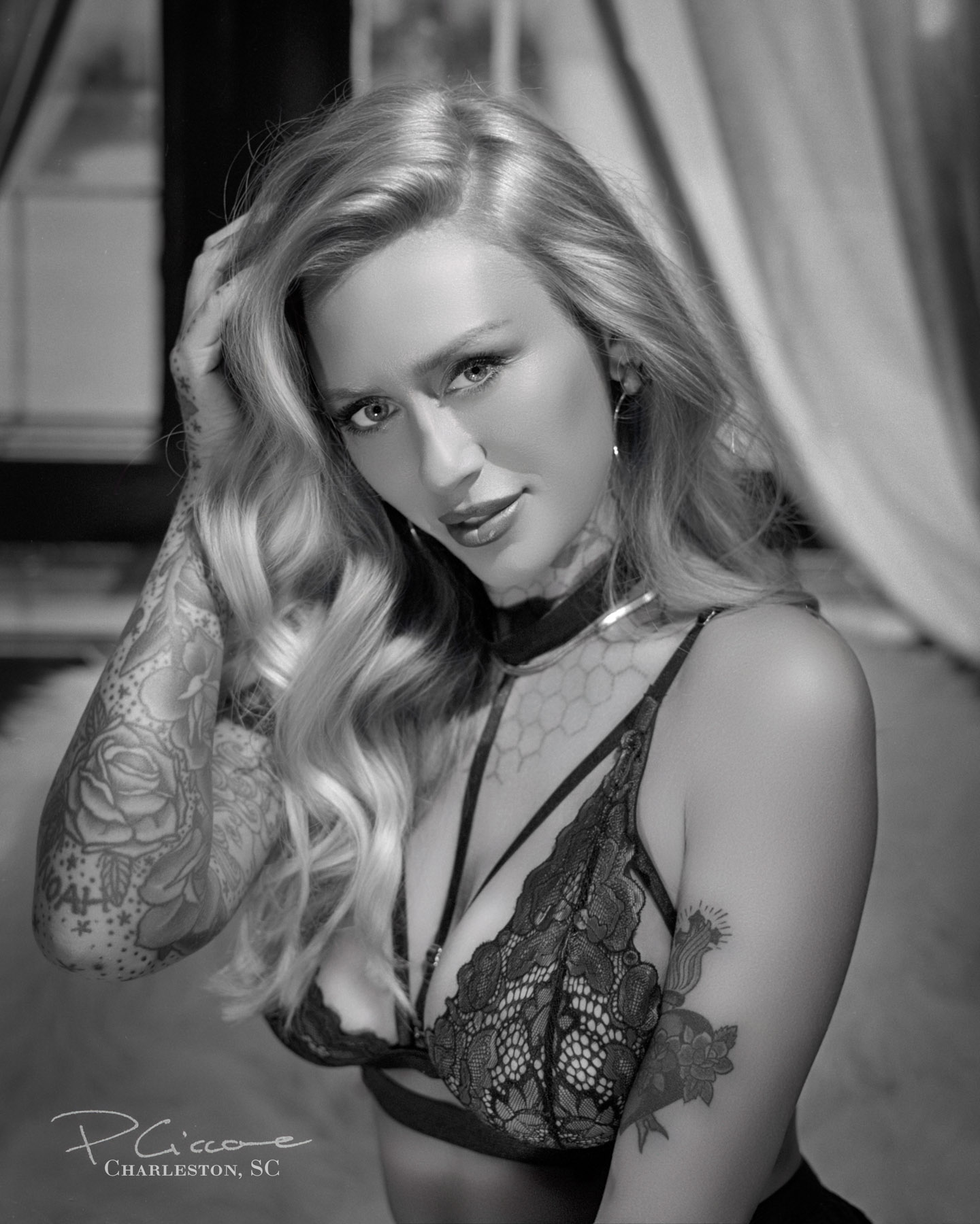 Playful black and white portrait in the style of old Hollywood, made by Paolo Portraits in Charleston SC